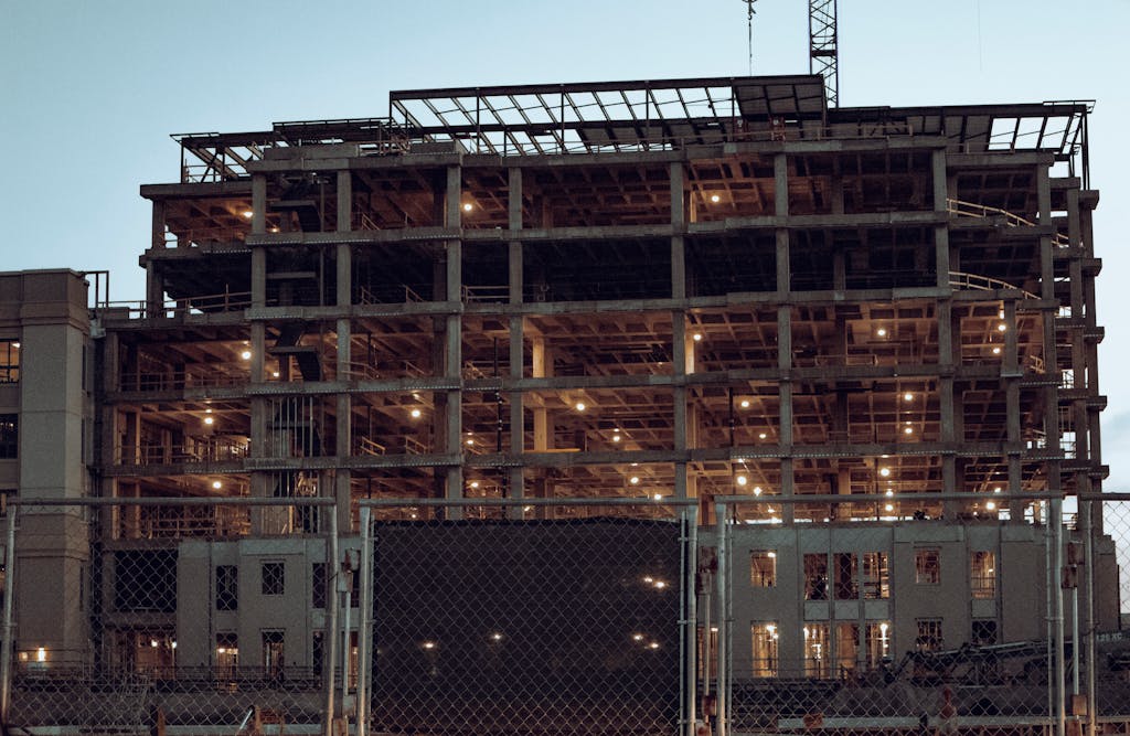 Illuminated construction site in Fort Worth, TX, showcasing modern urban development.