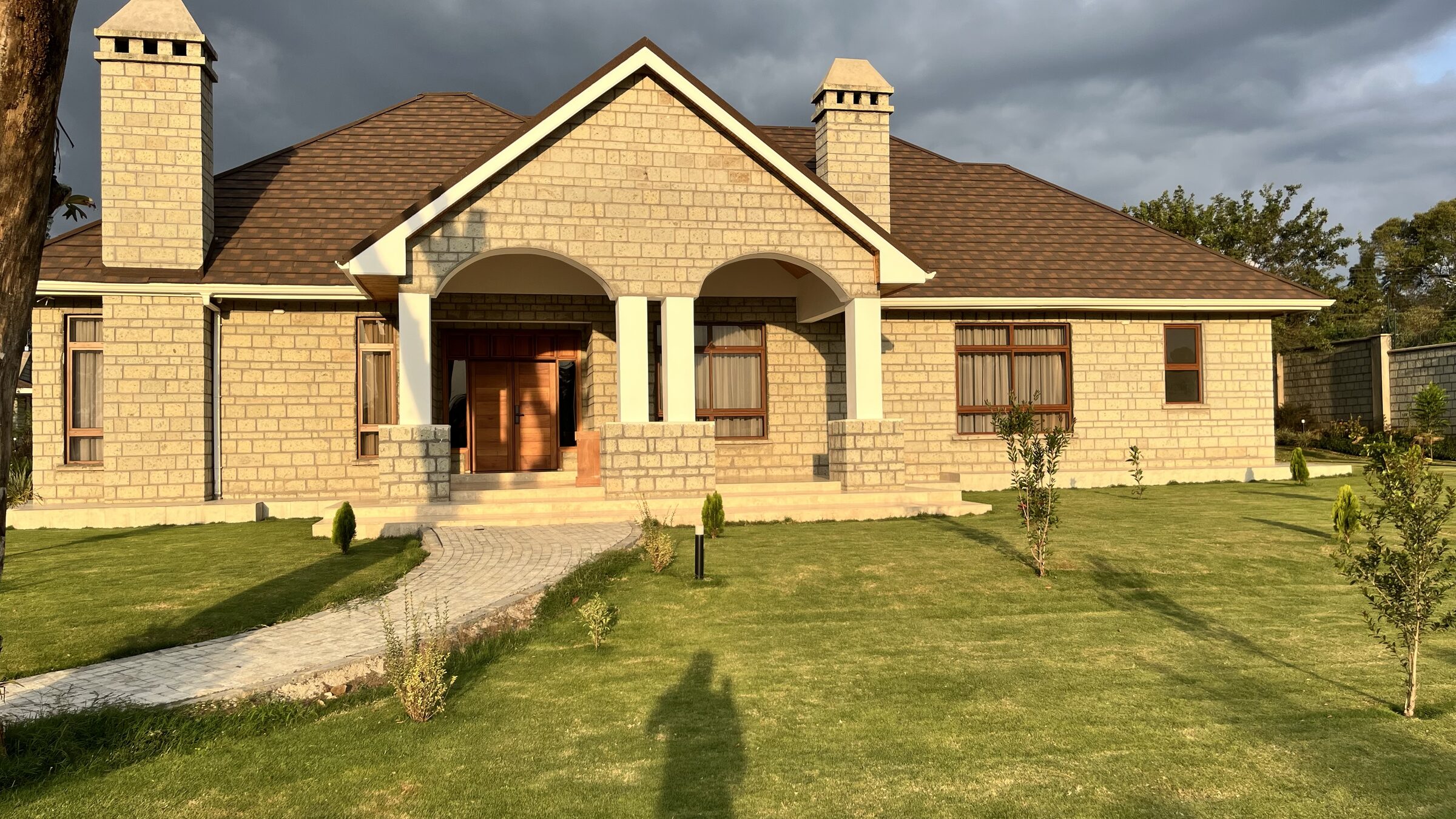 Finished stone house exterior at golden hour
